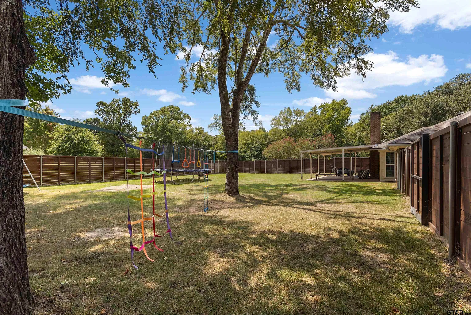 Mature trees and open lawn