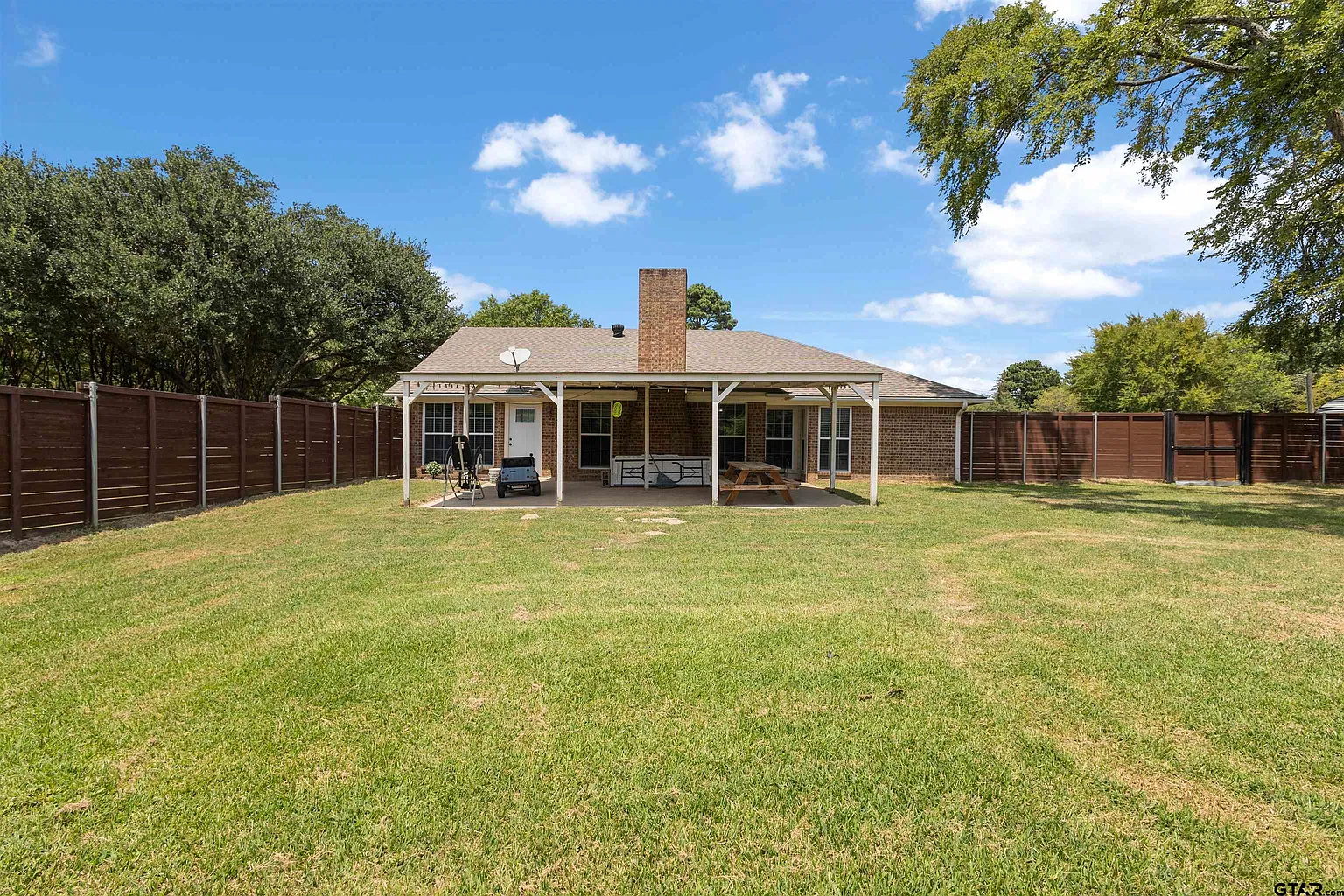 Wide back lawn and covered patio
