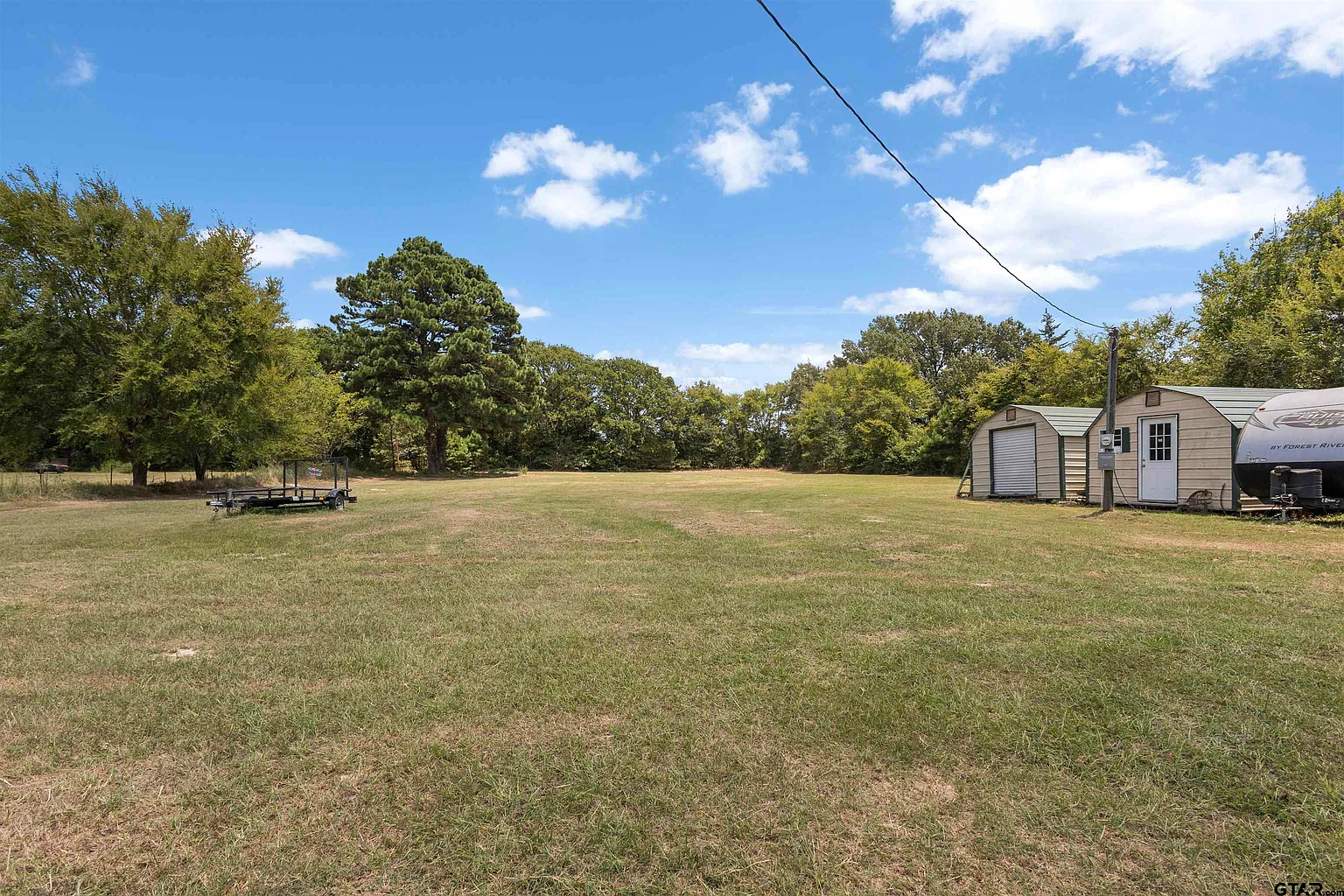 Open acreage with outbuildings